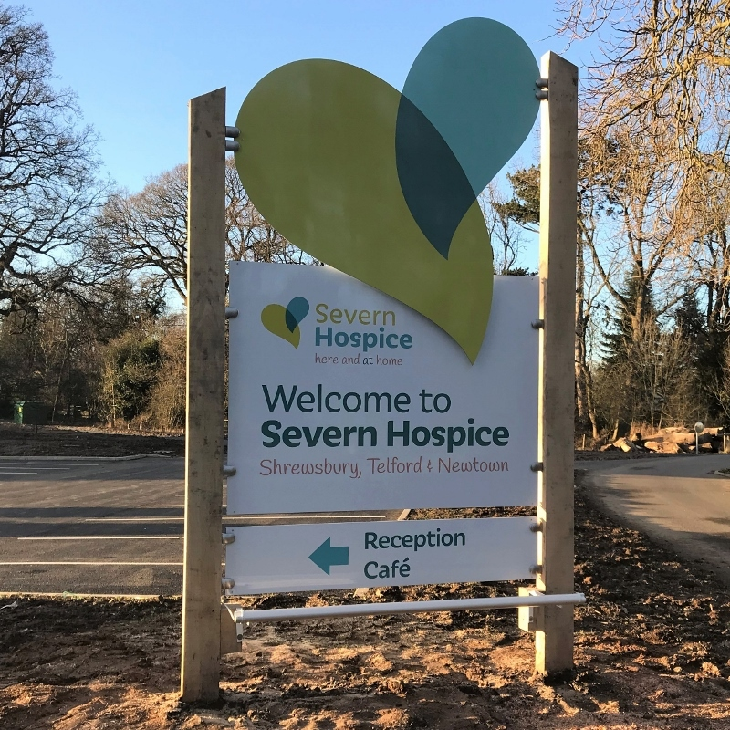 Severn Hospice timber post Welcome sign