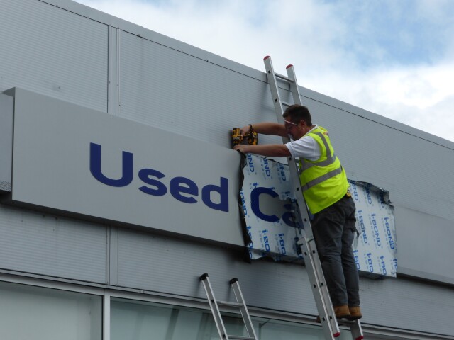 Signage installation off ladders