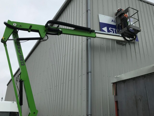 Signage installation using MEWP equipment